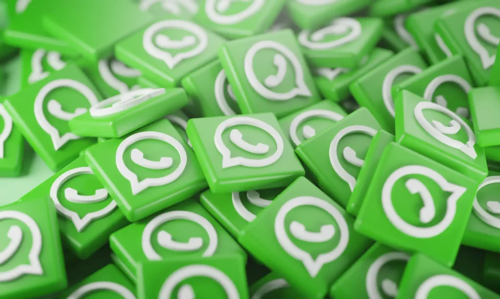 Imagem de vários ícones verdes do WhatsApp em um fundo misto, simbolizando a popularidade e uso da plataforma de mensagens instantâneas.
