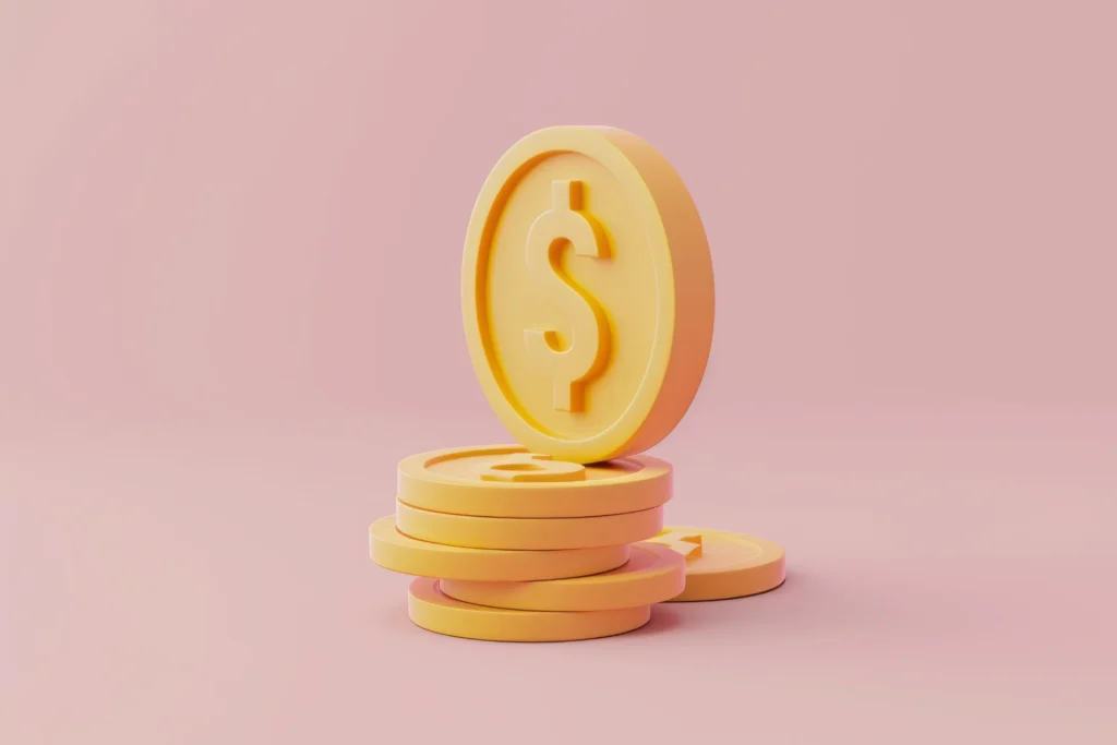 Imagem de moedas amarelas com símbolo de dólar, representando investimento, dinheiro e finanças em fundo rosa.